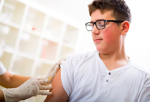 teen boy getting vaccine