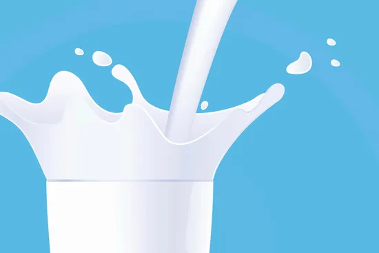 photo of pouring glass of milk