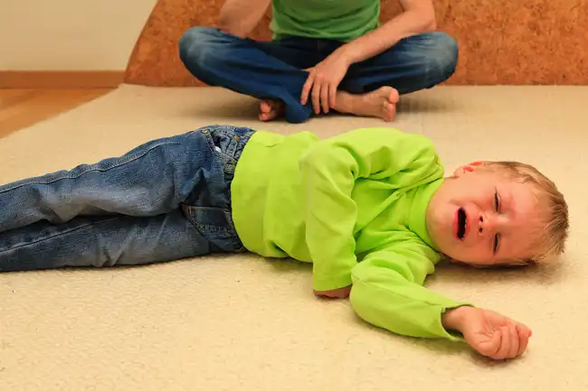 child crying on floor