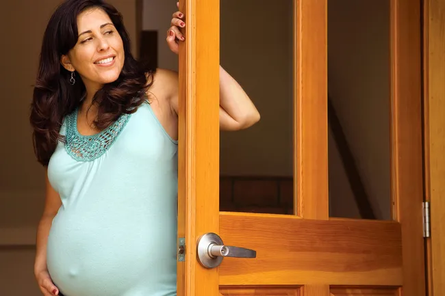 pregnant woman in doorway