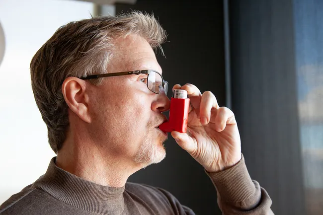 photo of person using inhaler