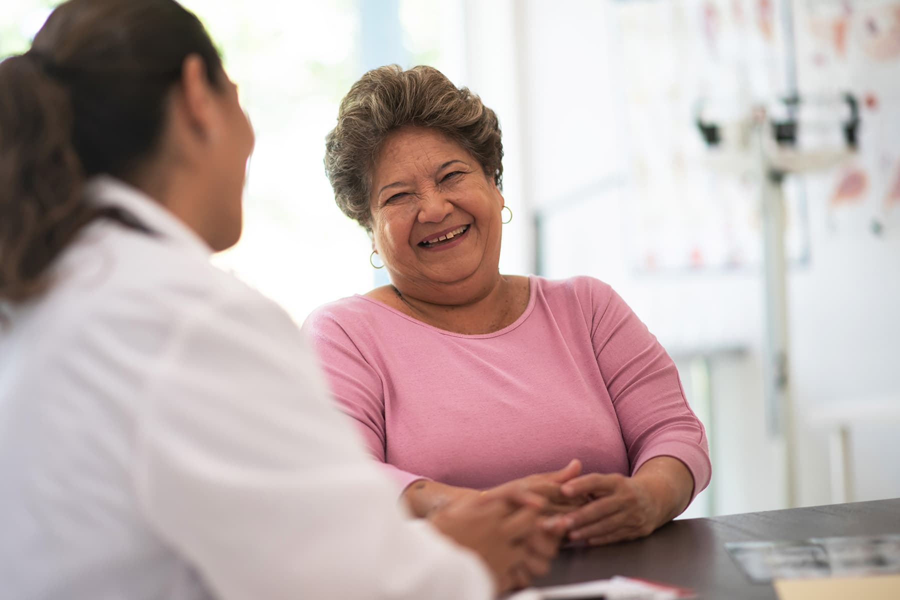 photo of doctor talking with patient