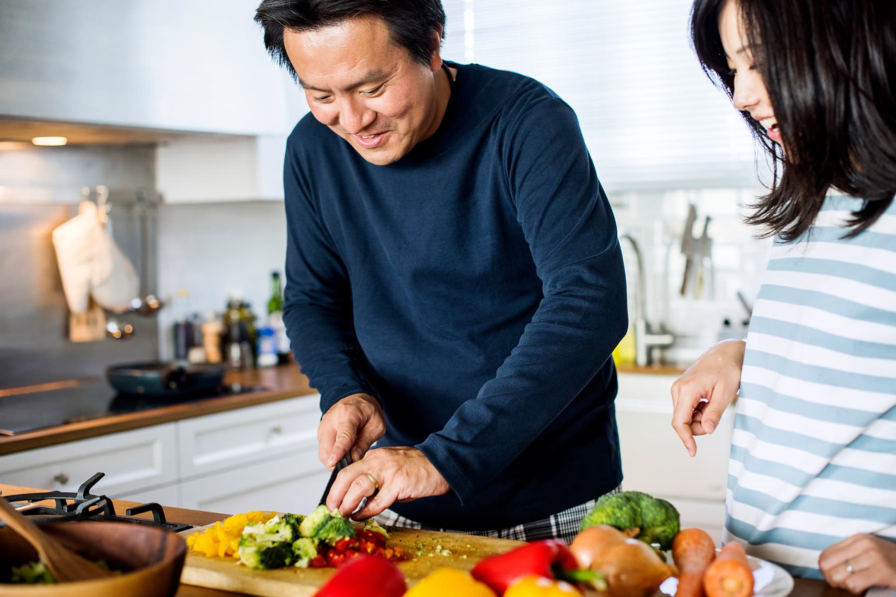 photo of couple preparing healthy meal