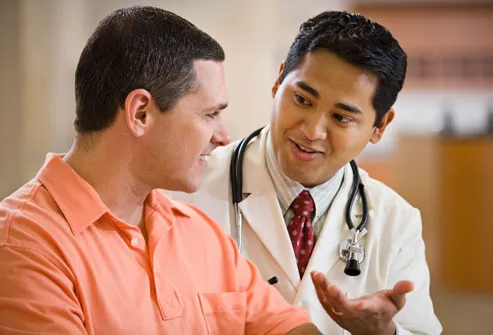 Doctor Talking To Man About Screening Test