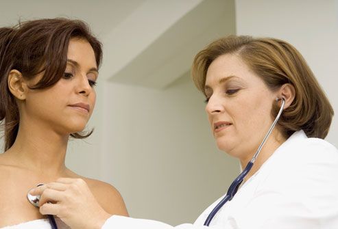Doctor Examining Woman With Stethoscope