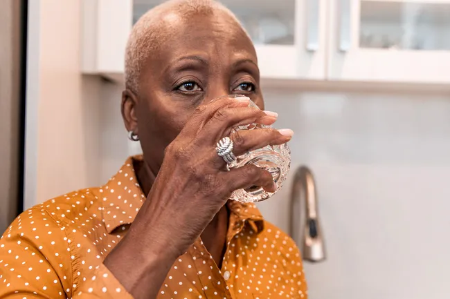 photo of senior woman drinking water