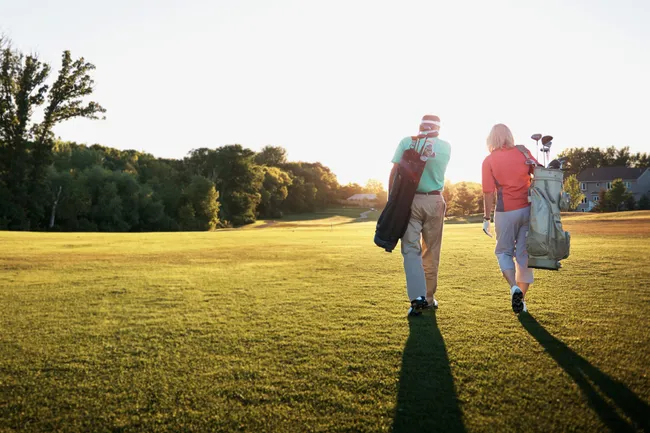 photo of senior couple playing golf