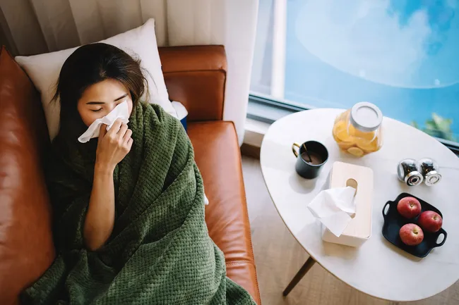 photo of sick woman with flu symptoms