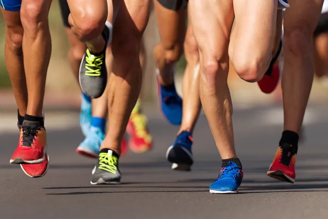 photo of legs of marathon runners