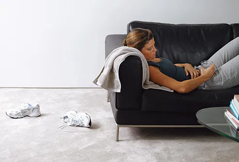 woman on couch after workout