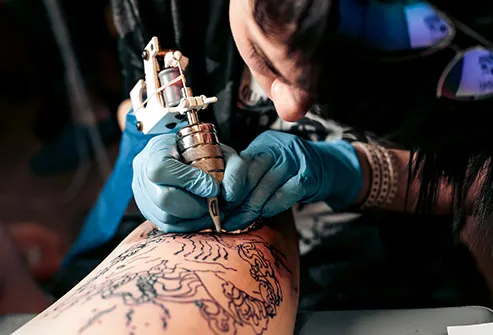 person getting tattoo