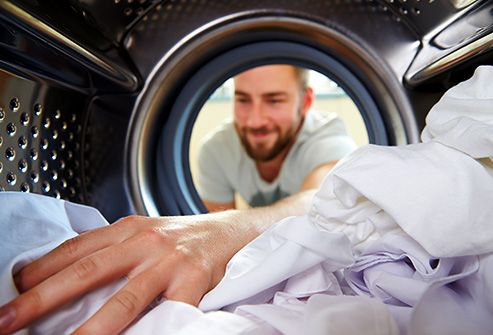 man doing laundry