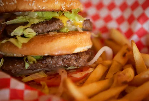 Cheeseburger and French fries, close-up