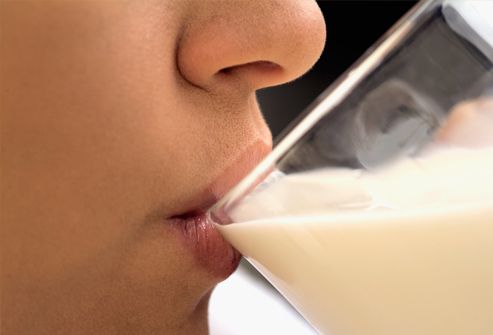 Woman drinking milk, close-up