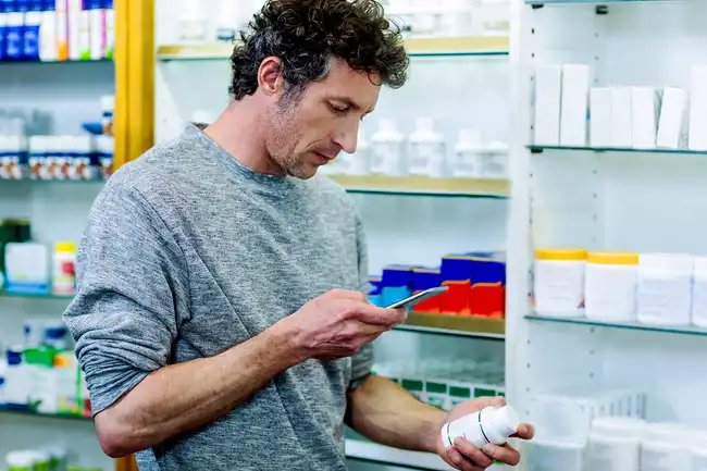 Man researching medicine label