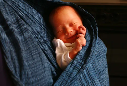 Smiling Newborn In Mother's Rebozo