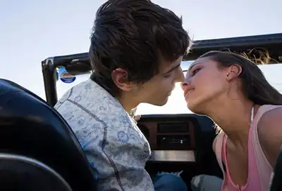 Teenagers Kissing In Car