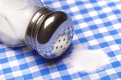 photo of pile of salt on a table cloth