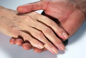 Older woman's hand with age spots