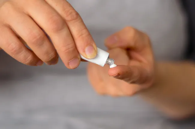 photo of putting cream on finger