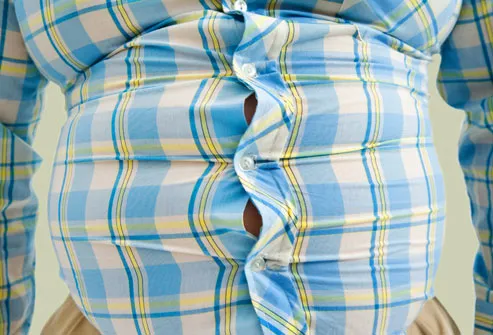 Close up of mans stomach in small shirt