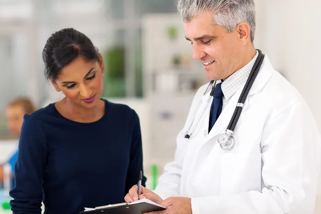 woman talking with doctor