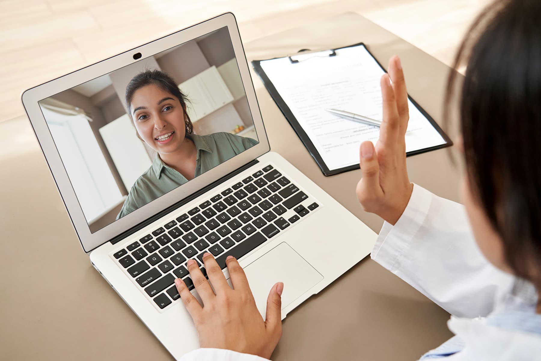 photo of woman talking with doctor telemedicine