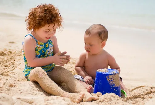 Kids Playing In Sand