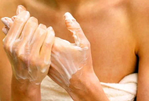 woman applying hand creme
