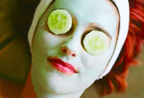 woman wearing cucumber mask