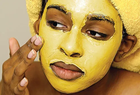 woman applying mask