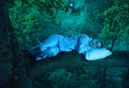 Woman visualizing sleeping in tree