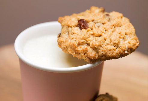 Close up of oatmeal cookie and milk