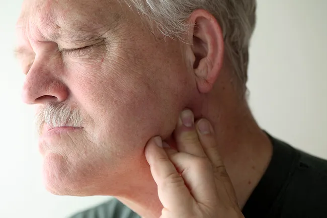 photo of man with jaw pain