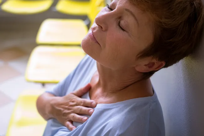 photo of mature woman with chest pain