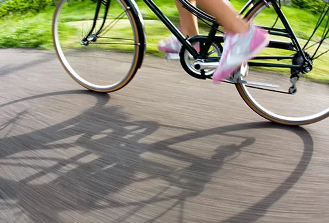 woman riding bicycle close up