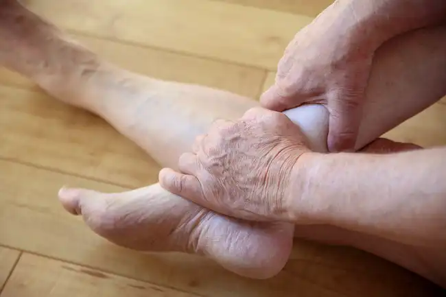 person holding ankle