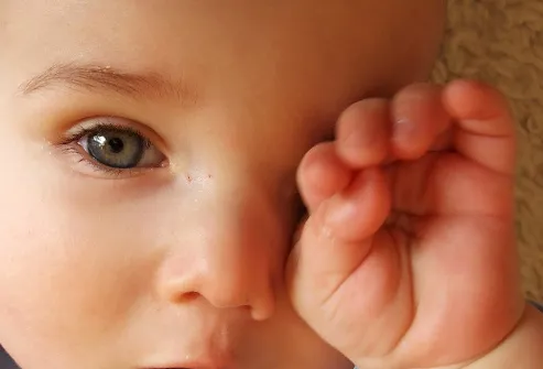 toddler rubbing eye