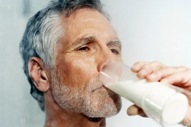 senior man drinking milk
