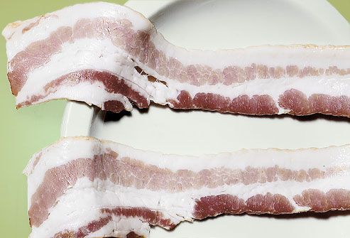 Uncooked Bacon on Plate