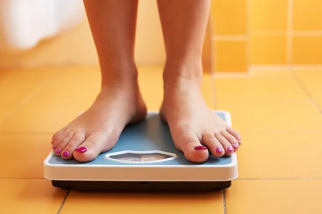 photo of feet on weight scale