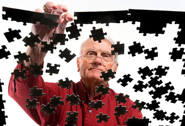 man solving puzzle