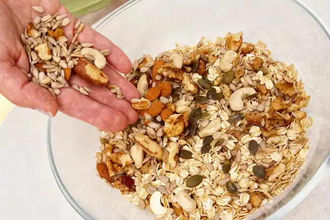 mixing nuts into muesli