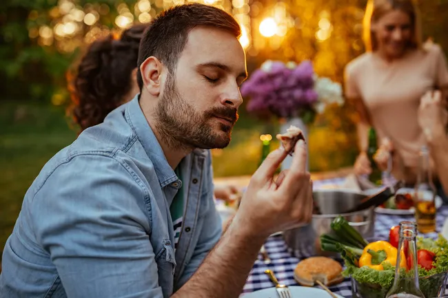 photo of man enjoying meal