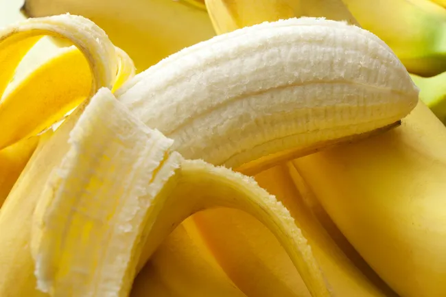 photo of peeled bananas
