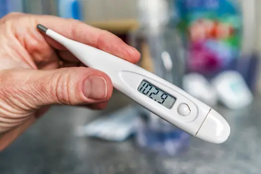 photo of thermometer showing high fever