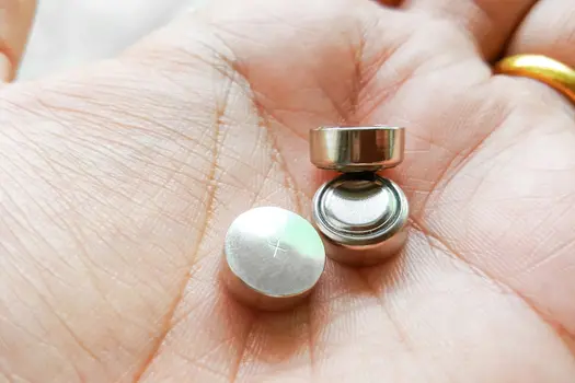 button batteries in hand