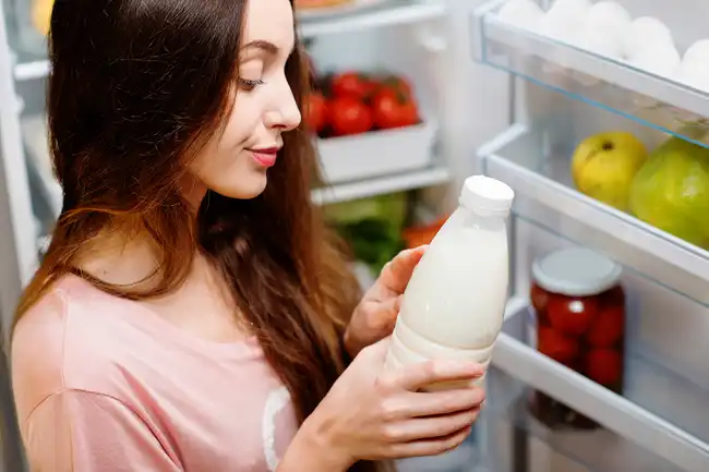woman reading milk label