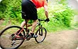 person riding bike on trails