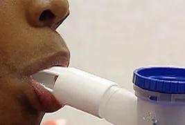 person using inhaler